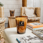 Baobab Collection Cuir de Russie 4-wick scented candle in mouth-blown glass, 1.1kg, styled in a room setting 2