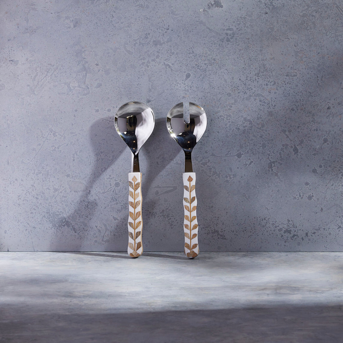Be Home Mya inlay salad serving set in stainless steel, styled in a room setting