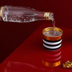 Sieger by Fürstenberg Sip-of-Gold Cross Stripes Champagne Goblet, styled in a table setting