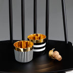 Sieger by Fürstenberg Sip-of-Gold Vertical Stripes Champagne Goblet, styled in a table setting