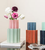 The Socialite Family Duetto vase in candy pink ceramic and almond green glass, 28cm, styled in a room setting