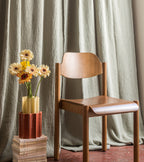The Socialite Family Duetto vase in amber yellow glass and terracotta ceramic, 28cm, styled in a room setting 2