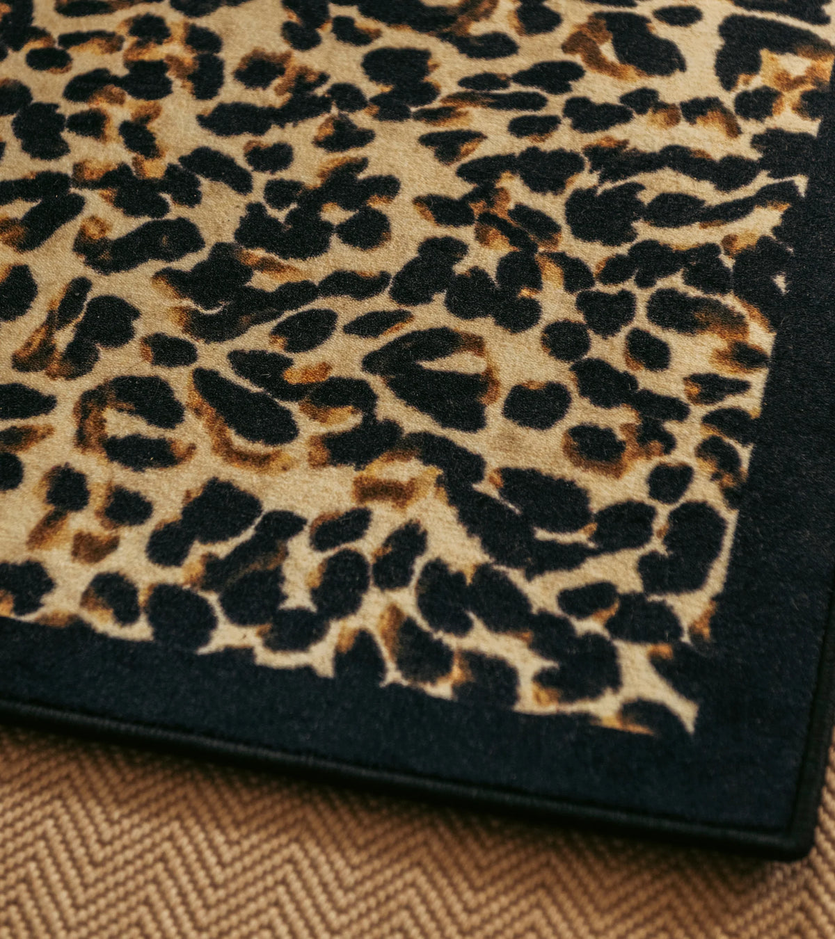 The Socialite Family Leopardo rug in leopard print, 150x200cm, styled in a room setting 2