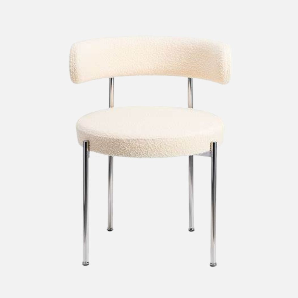 The Socialite Family Libera chair in cream curly wool with a chromed metal frame, front view
