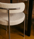The Socialite Family Libera chair in cream curly wool with a chromed metal frame, styled in a room setting 4
