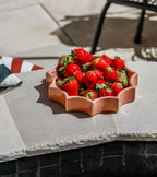 The Socialite Family Tasca décor tray in soft pink glazed ceramic, 22cm, styled in a room setting